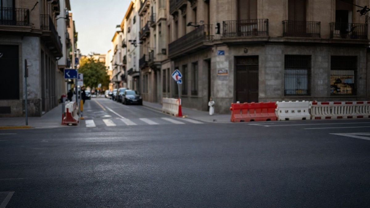 Illustrative image: a generic street with construction fences and a designated pedestrian crossing