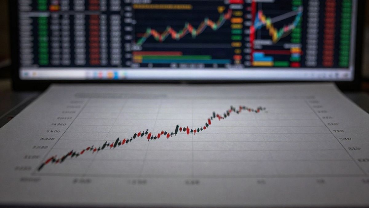 Illustrative image: graph showing economic growth trends with blurred financial elements in the background.