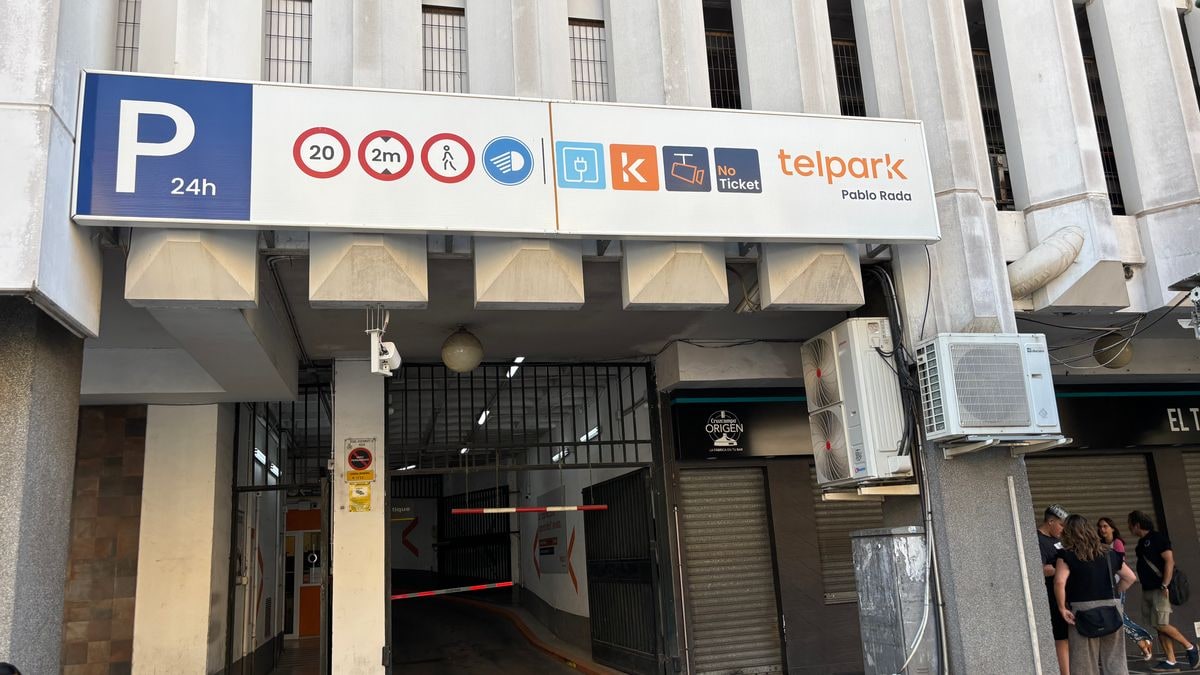 Illustrative image: interior of a car park with empty spaces and natural light