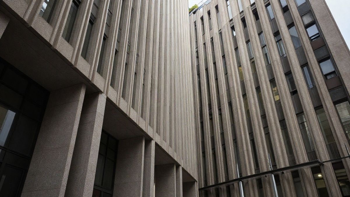 Illustrative image: view of a modern bank with converging lines and dramatic natural light.